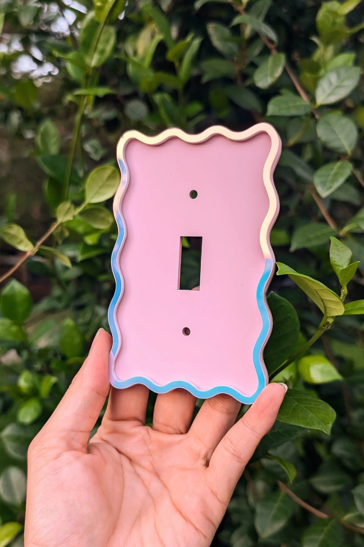 Squiggly iridescent and pink light switch cover blue and pink color changing