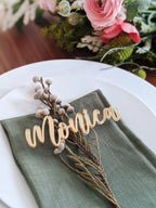 Gold acrylic custom name place card on dinner plate at a wedding party